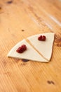 Process of cooking small croissants with cherry for breakfast. Pieces of dough with cherry filling.