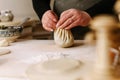 Process cooking. Woman making khinkali for his family close-up. Preparing georgian traditional meal of dough and meat at kitchen.