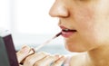 The process of cosmetic paint womans lips