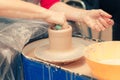 The process of creating a ceramic cup on a potter`s wheel Royalty Free Stock Photo