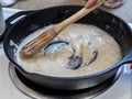 Process of creating a roux out of flour and butter in a cast iron skillet Royalty Free Stock Photo