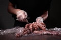 The process of cutting the carcass of boiled octopus. The removal of the eye. Knife in the hands of the chef.Unrecognizable photo Royalty Free Stock Photo