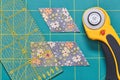 The process of cutting pieces of fabric in the shape of diamonds to create a quilt