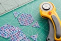 The process of cutting pieces of fabric in the shape of hexagons to create a quilt