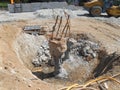 The process of cutting piles after the completion of building foundation piling work. Royalty Free Stock Photo