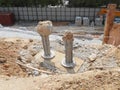 The process of cutting piles after the completion of building foundation piling work. Royalty Free Stock Photo