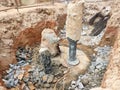 The process of cutting piles after the completion of building foundation piling work. Royalty Free Stock Photo