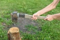 The process of cutting wood with a cleaver. Man is holding an axe and about to chop Royalty Free Stock Photo