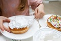 Process of decorating a cake with sweet colored decorations