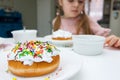 Process of decorating a cake with sweet colored decorations