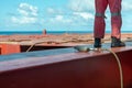 Process of derusting, paint and rust removal by pneumatic chisel from ship deck by vessel crew Royalty Free Stock Photo