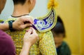 The process of dressing the Thai pantomime for the actors with hand sewing, repairing