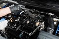 Process of drying car engine after washing with water and chemical detergent. Detailing cleaning motor from dust and Royalty Free Stock Photo