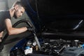 Process of drying car engine after washing with water and chemical detergent. Detailing cleaning motor from dust and Royalty Free Stock Photo