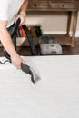 Process of extraction dirt from mattress using extractor cleaning machine. Dry wash cleaner is removing dirt and dust Royalty Free Stock Photo