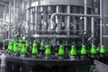 The process of filling beer into bottles on a production conveyor line Royalty Free Stock Photo