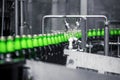 The process of filling beer into bottles on a production conveyor line. Royalty Free Stock Photo