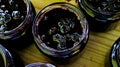 The process of filling homemade chokeberry jam on a tray. Banner. Jars full of jam, ready to close