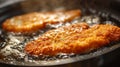 Process of frying delicious authentic breaded Wiener schnitzel in hot sizzling butter ina pan