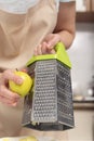 Process of grating an apple. Chef`s hands Royalty Free Stock Photo