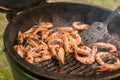 Big shrimp in shell during grilling Royalty Free Stock Photo