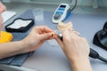 Process of grinding the jaw during production. The dental technician processes artificial teeth with a micromotor.