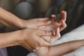 Process of hand massage. Wrist knuckle tendon stretching and acupressure for relaxation and healing in the spa for Asian woman Royalty Free Stock Photo