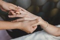 Process of hand massage. Wrist knuckle tendon stretching and acupressure for relaxation and healing in the spa for Asian woman Royalty Free Stock Photo