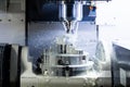 A process of industrial wet milling in 5-axis cnc machine with coolant flow under pressure and freezed splashes