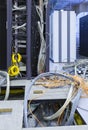 Process of installation and cabling in modern data center. Server rack with skeins of cables next to the disassembled Royalty Free Stock Photo