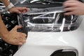 The process of installing PPF on the hood of the car. Anti-gravity protection. PFF is installed. Royalty Free Stock Photo