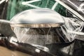 The process of installing PPF on the side mirror. Car wrapping. Royalty Free Stock Photo