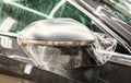 The process of installing PPF on the side mirror. Car wrapping. Royalty Free Stock Photo