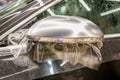 The process of installing PPF on the side mirror. Car wrapping. Royalty Free Stock Photo