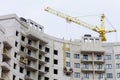 The process of insulating external walls in a multi-storey building under construction Royalty Free Stock Photo