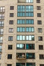 The process of insulating external walls in a multi-storey building under construction Royalty Free Stock Photo