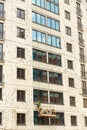 The process of insulating external walls in a multi-storey building under construction Royalty Free Stock Photo