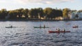 A process of kayaking in the city river canals, with colorful canoe kayak boat paddling, process of canoeing, group of kayaks,