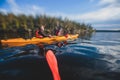 A process of kayaking in the lake skerries, with canoe kayak boat, process of canoeing, aerial shot from drone