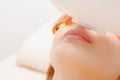 Process laser hair removal treatment in salon young woman having mustache.