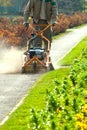 Process of lawn mowing, concept of mowing the lawn, lawnmower cutting grass with gardening tools.. Royalty Free Stock Photo