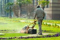 Process of lawn mowing, concept of mowing the lawn, lawnmower cutting grass with gardening tools.. Royalty Free Stock Photo