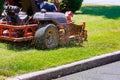 process of lawn mowing, concept of mowing the lawn, lawnmower cutting grass with gardening tools Royalty Free Stock Photo