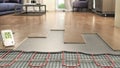 Process of laying laminate panels on floor with underfloor heating Royalty Free Stock Photo