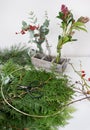 The process of making a Christmas wreath from juniper, scimia, eucalyptus Royalty Free Stock Photo