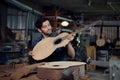 The process of making a classical guitar, Luthier checking guitar