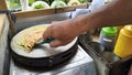 The Process of Making Colorful Crepe / Serabi Jala Snacks at a Roadside Cart Royalty Free Stock Photo