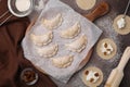 Process of making dumplings (varenyky) with cottage cheese. Raw dough and ingredients on brown table, flat lay Royalty Free Stock Photo