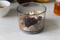 The process of making energy bars at home. Oatmeal, cranberries, raisins, pumpkin seeds, nuts. Royalty Free Stock Photo