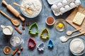 The process of making gingerbread cookies. Baking ingredients for homemade pastry on dark background. Top view, flat lay Royalty Free Stock Photo